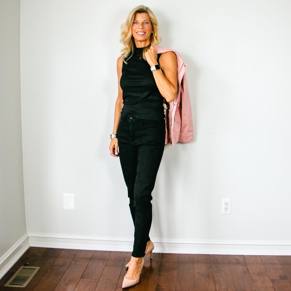 Black Sleeveless Mock Turtleneck Shirt with Black Jeans and Pink Utility Jacket Outfit