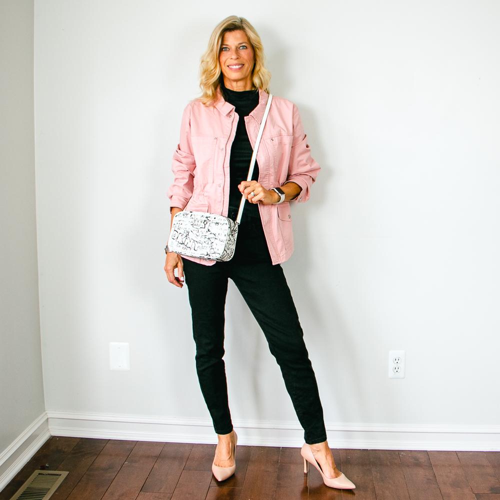 Pink Utility Jacket with Black Jeans and DKNY Camera Bag Outfit