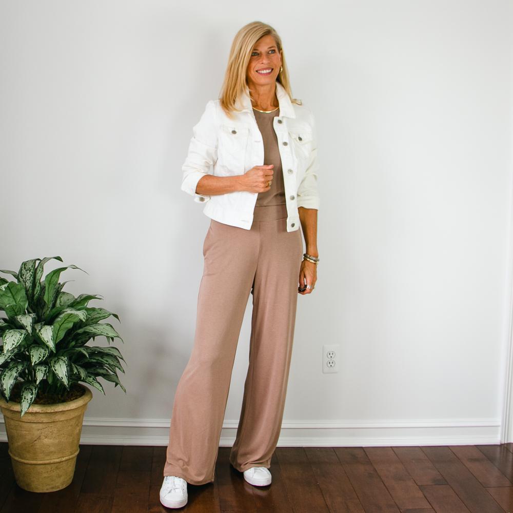 White denim jacket with taupe wide leg pants outfit
