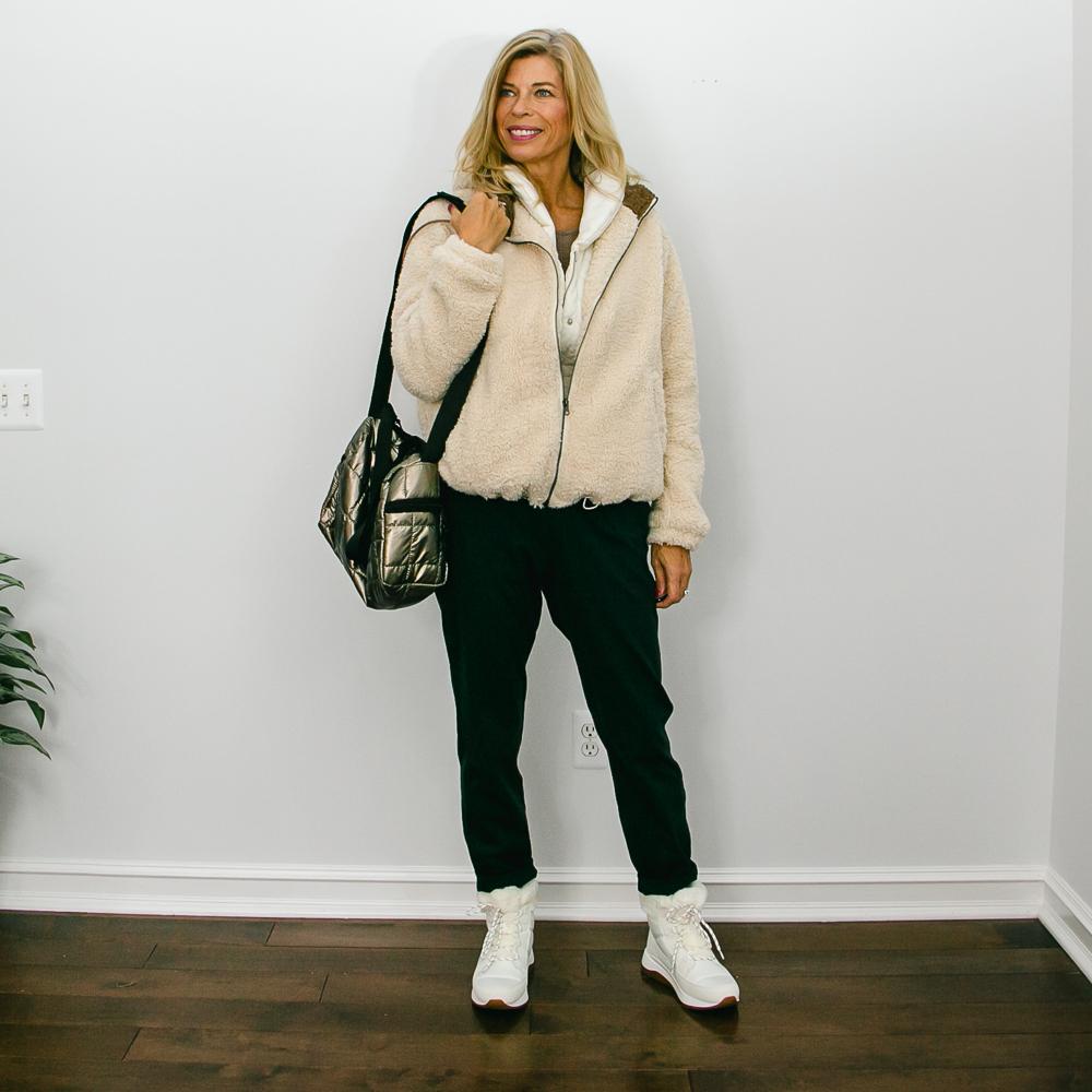 jogger outfits with a shearling coat and metallic quilted bag


